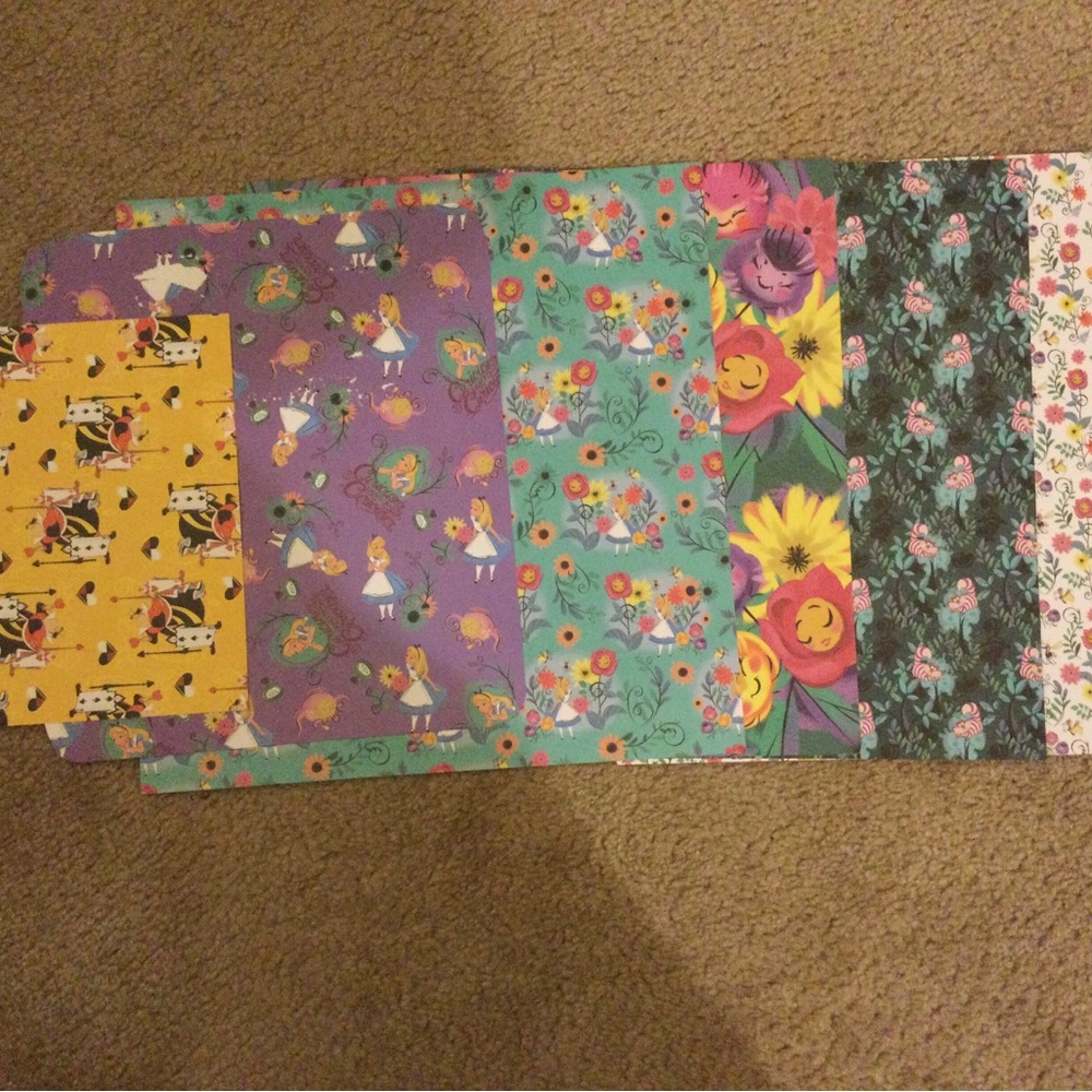 7 double sided Alice in Wonderland scrapbook papers, 1 single sided, stickers